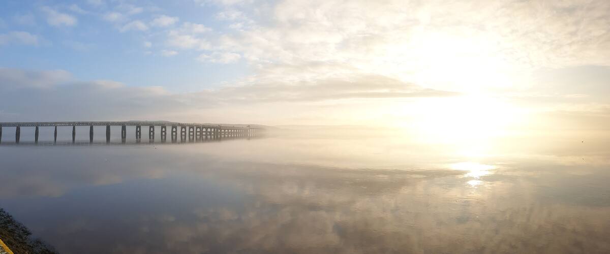 The tay rail bridge looking magnificent in the sun and mist