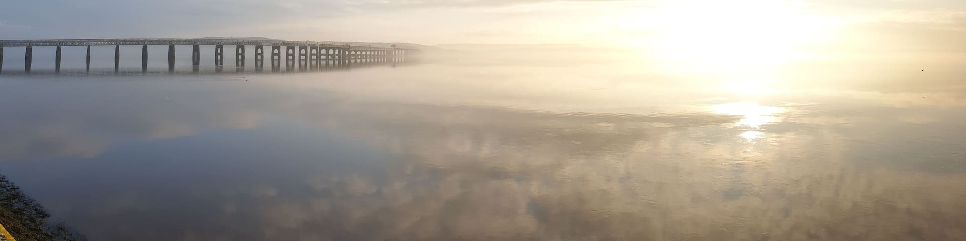 The tay rail bridge looking magnificent in the sun and mist
