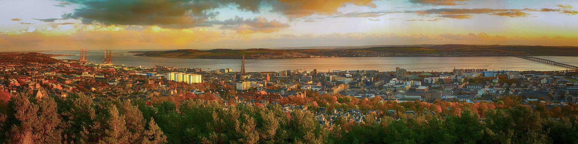 Colorful Panoramic shot of the Tay Rail Bridge of Dundee Law in Scotland at twilight,UK , Dramatic beautiful sunset