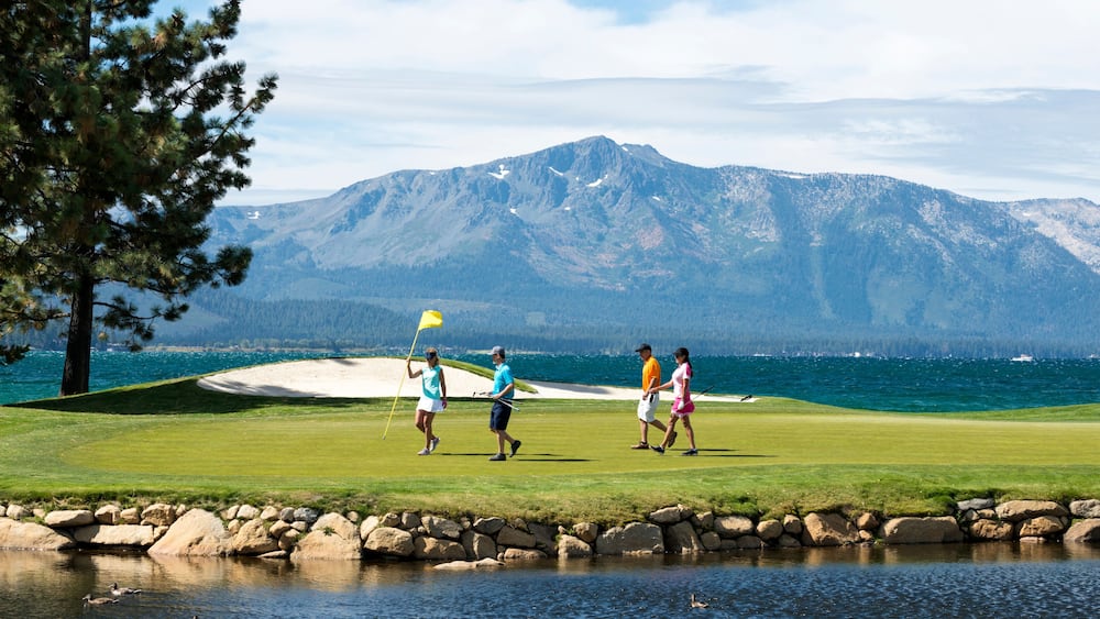 A group of friends golfing at Edgewood Tahoe in Stateline, Nevada.