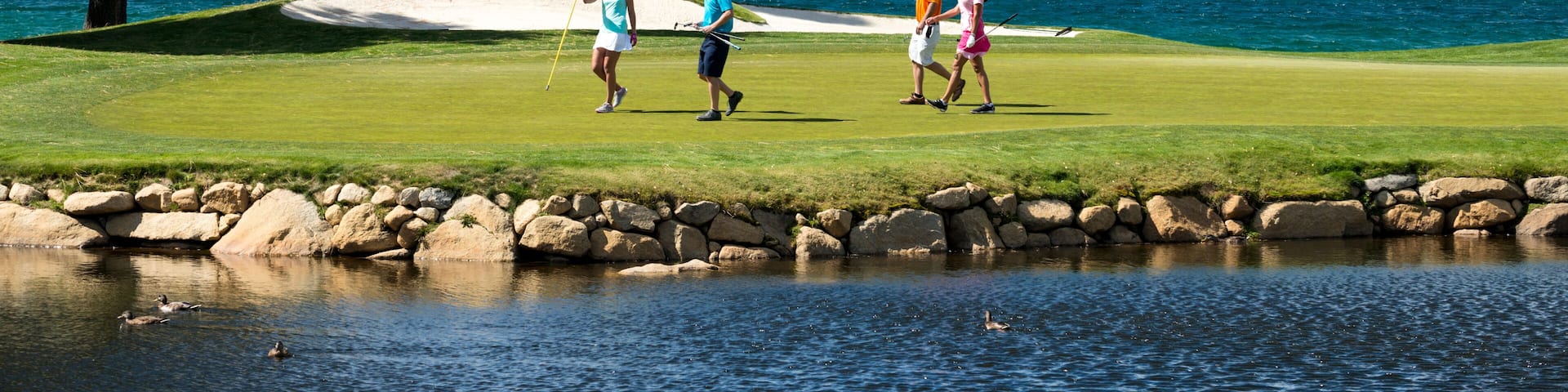 A group of friends golfing at Edgewood Tahoe in Stateline, Nevada.