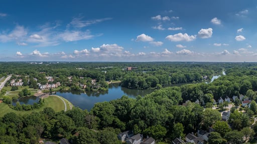Aerial panorama of single family homes and town house neighborhoods around Lake Elkhorn, a manmade lake in Owen Brown village in Columbia Maryland USA