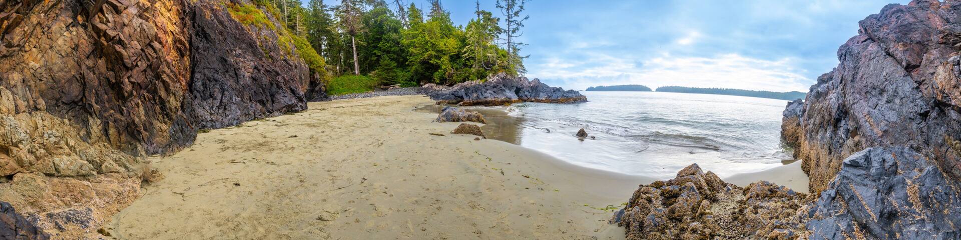 Panoramic view of mackenzie beach embracing the pacific ocean in tofino, vancouver island