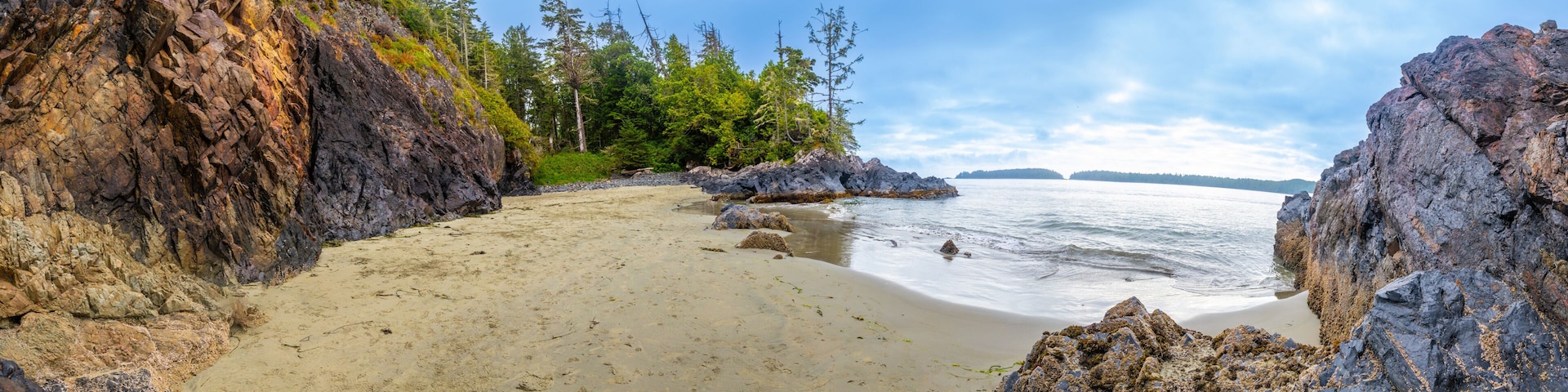 Panoramic view of mackenzie beach embracing the pacific ocean in tofino, vancouver island