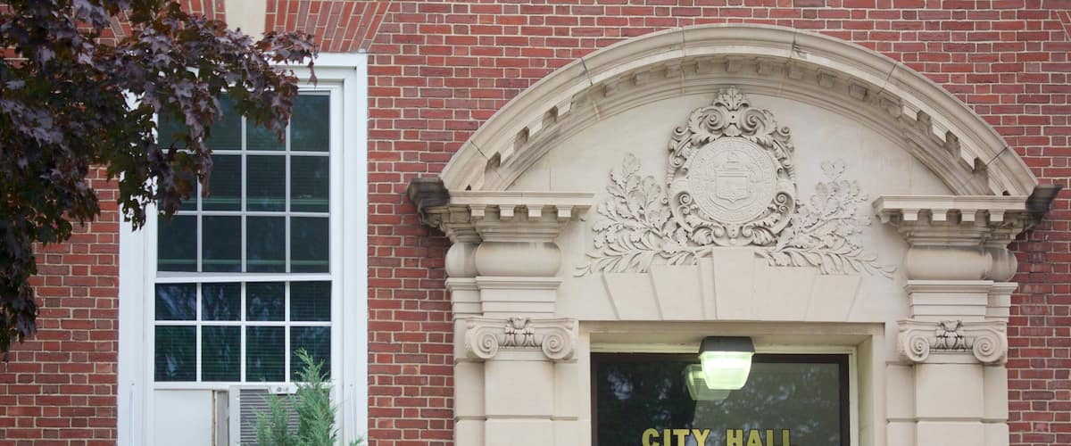 Woburn which includes an administrative buidling and street scenes