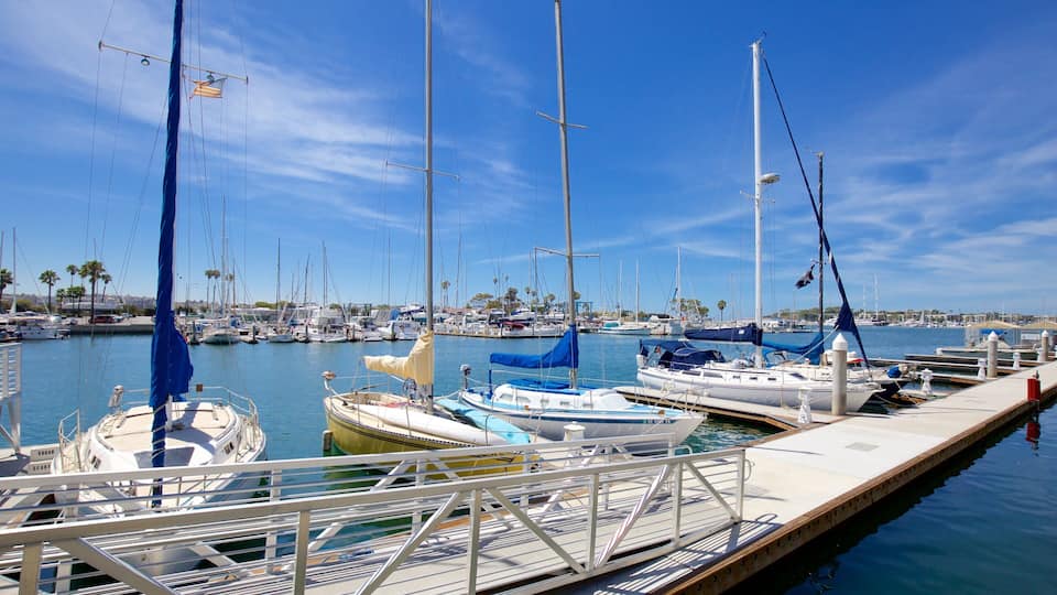 A marina with several sailboats docked at the pier.