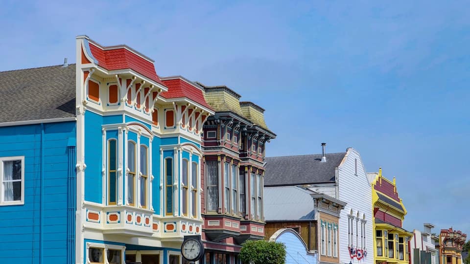 Colorful Victorian-style buildings with distinct architectural details.