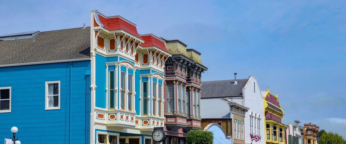 Colorful Victorian-style buildings with distinct architectural details.