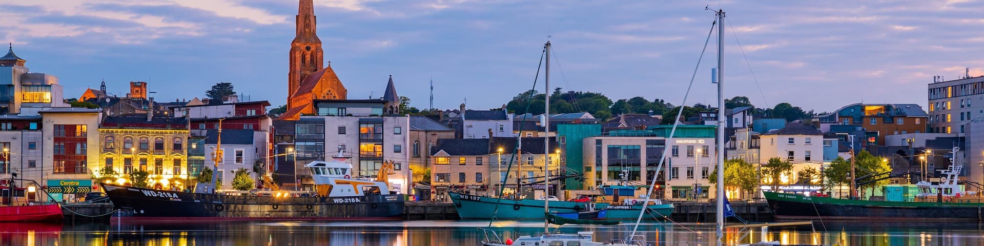 Wexford which includes a bay or harbor and a sunset
