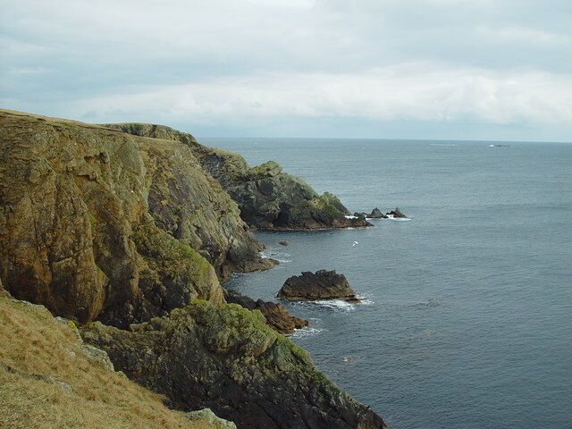 Clett Head, Whalsay, Shetland. Looking SE along Clett Head to The Haa, Near the horizon in the distance is the skerry known as the Muckle Fladdicap.
