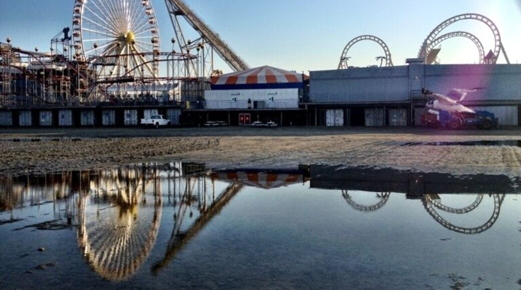 Heading to the beach for a stroll after eating some fries and enjoying some water ice, a storm that vacationed here long before I arrived situated itself in a puddle, reflecting on the fun to be had.