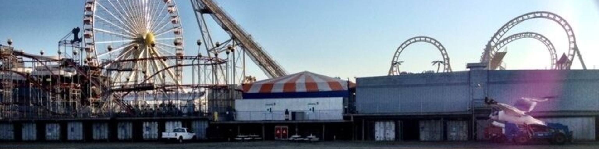 Heading to the beach for a stroll after eating some fries and enjoying some water ice, a storm that vacationed here long before I arrived situated itself in a puddle, reflecting on the fun to be had.