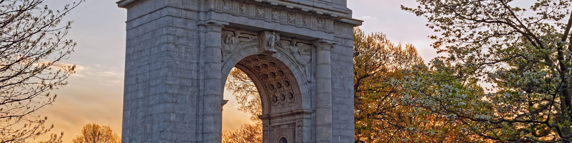 A springtime sunrise at Valley Forge National Historical Park in Pennsylvania, USA.The National Memorial Arch is a monument dedicated to George Washington and the United States Continental Army.