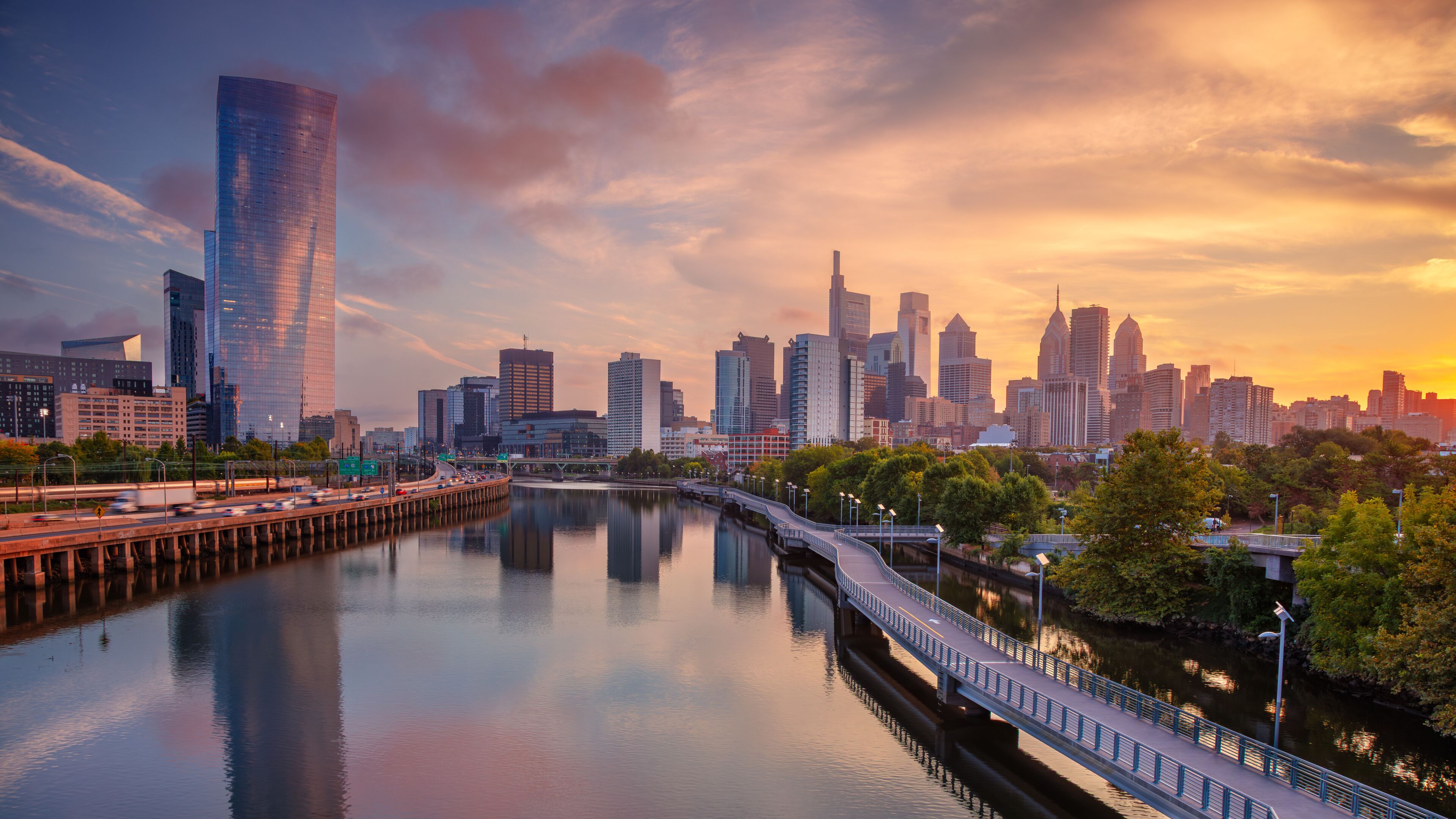 Philadelphia, Pennsylvania, USA. Cityscape image of downtown Philadelphia, Pennsylvania and Schuylkill River leading to the city at beautiful autumn sunrise.