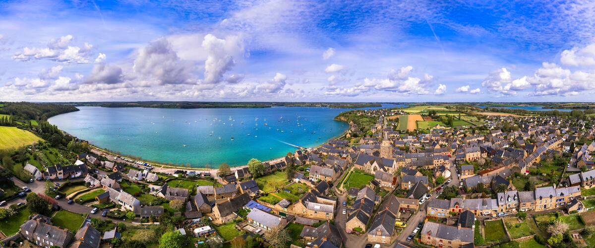A coastal town with a harbor, houses, and a church.