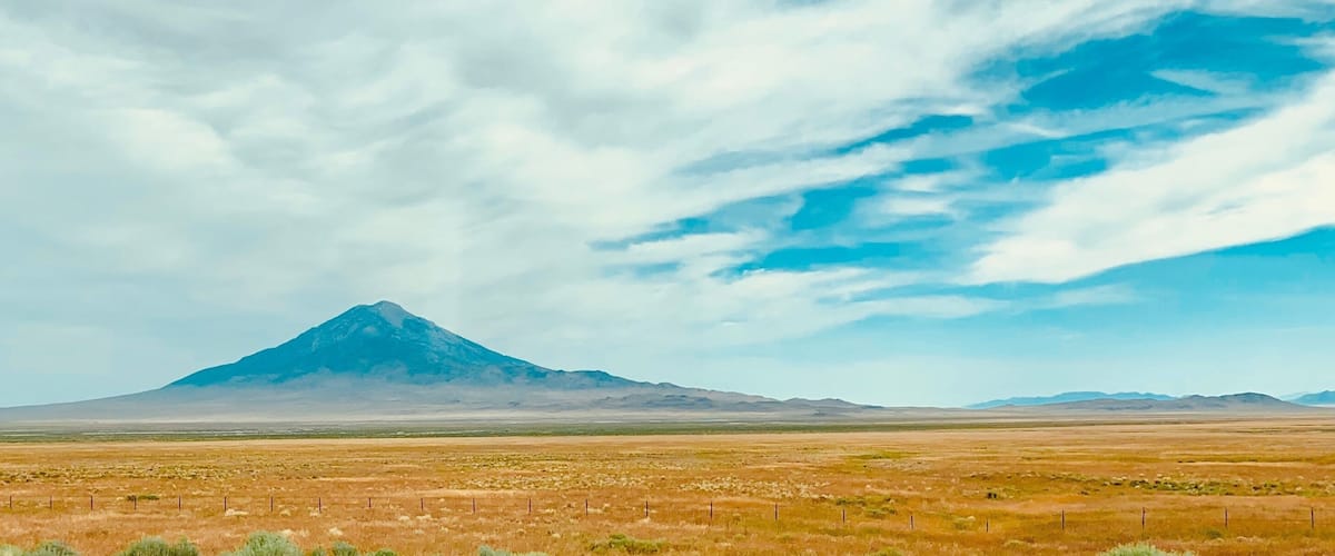 Almost perfect conical shaped mountain while driving through the I-80 along Wendover Nevada. 
#Nature