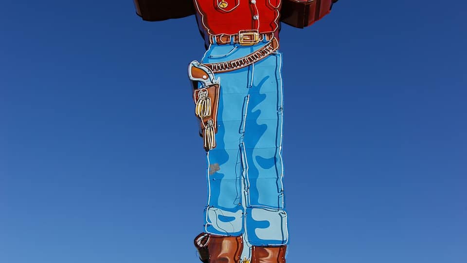 A statue of a cowboy with a sign that reads 'Wendover Will welcomes you to West Wendover, Nevada.'