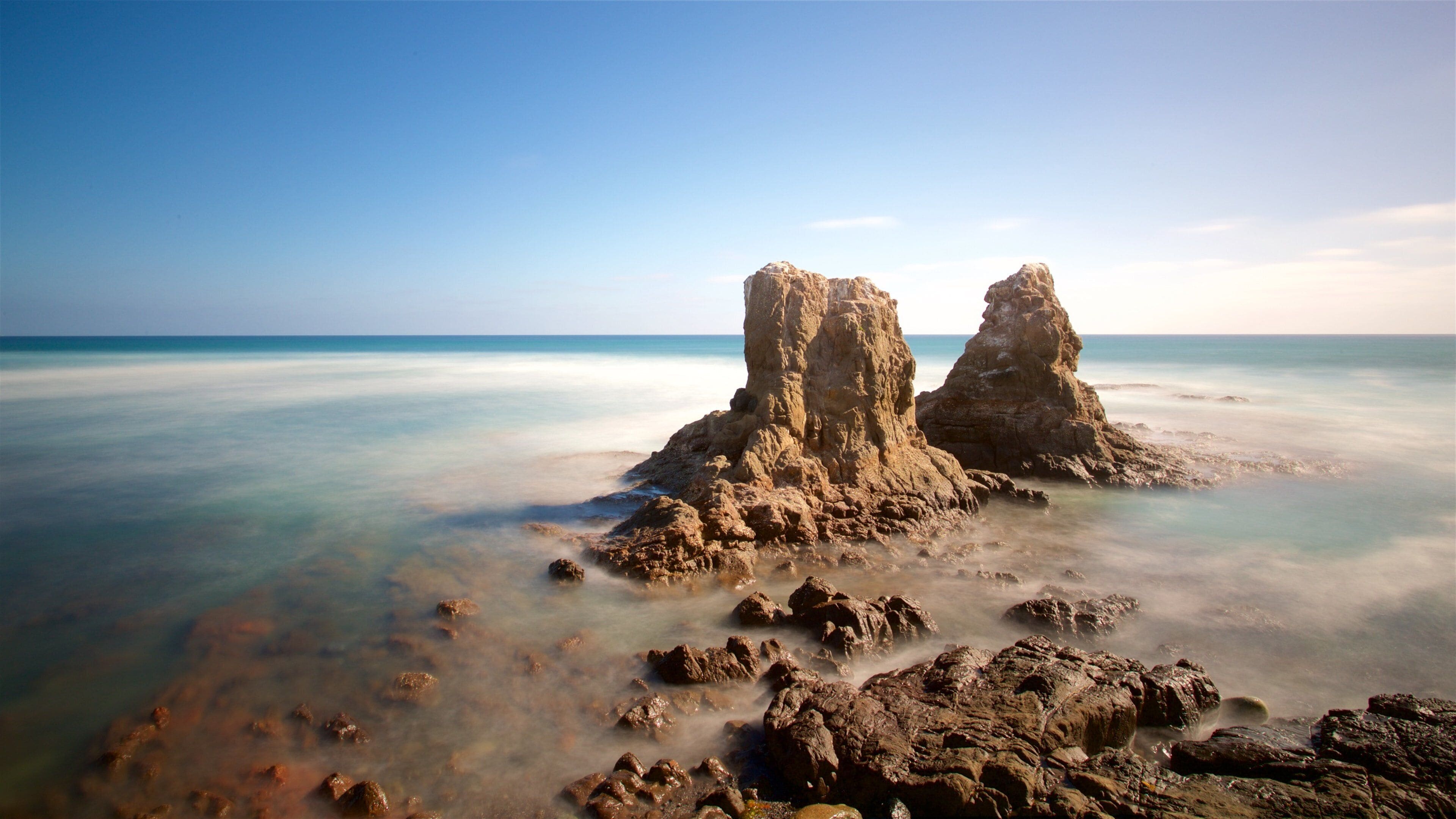 Rosarito which includes general coastal views and rocky coastline