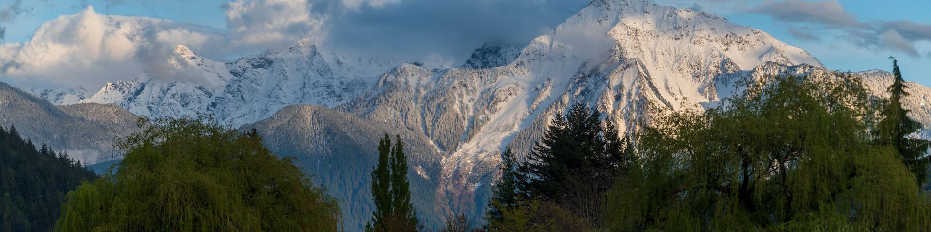 The Mount Cheam Range above the Harrison Hot Springs Resort during sunset. The Cheam Range is a mountain range in the Fraser Valley region of the Lower Mainland of British Columbia.