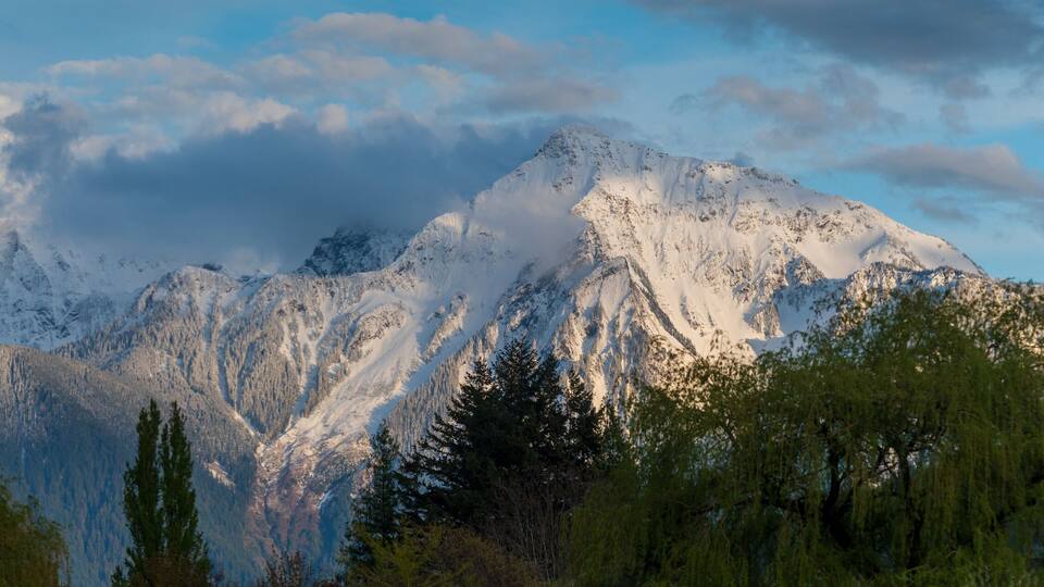 The Mount Cheam Range above the Harrison Hot Springs Resort during sunset. The Cheam Range is a mountain range in the Fraser Valley region of the Lower Mainland of British Columbia.