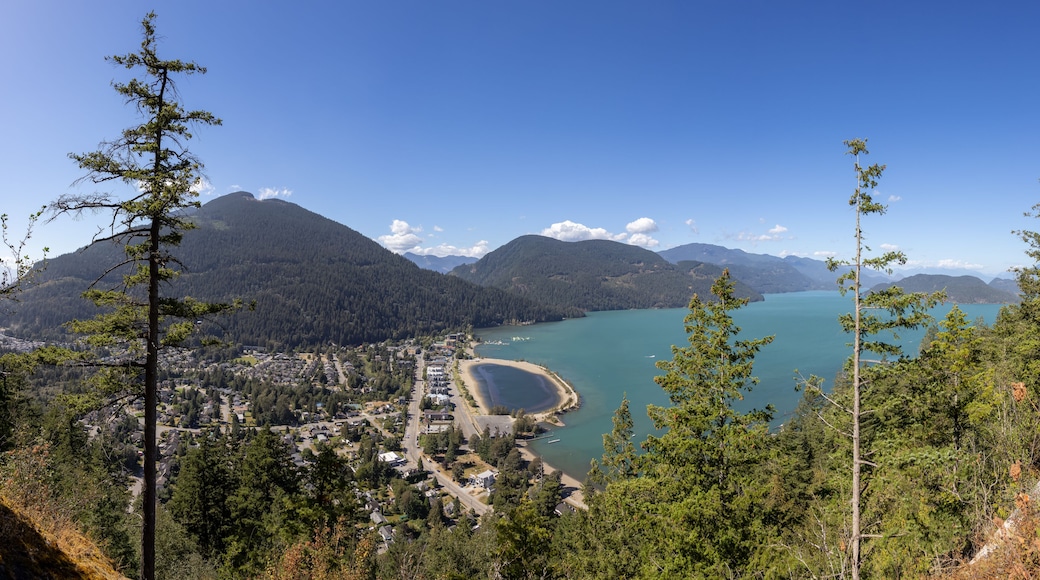 Panoramic View of Small touristic town by the lake with Canadian Mountain Landscape. Sunny Summer Day. Harrison Hot Springs, British Columbia, Canada. Panorama