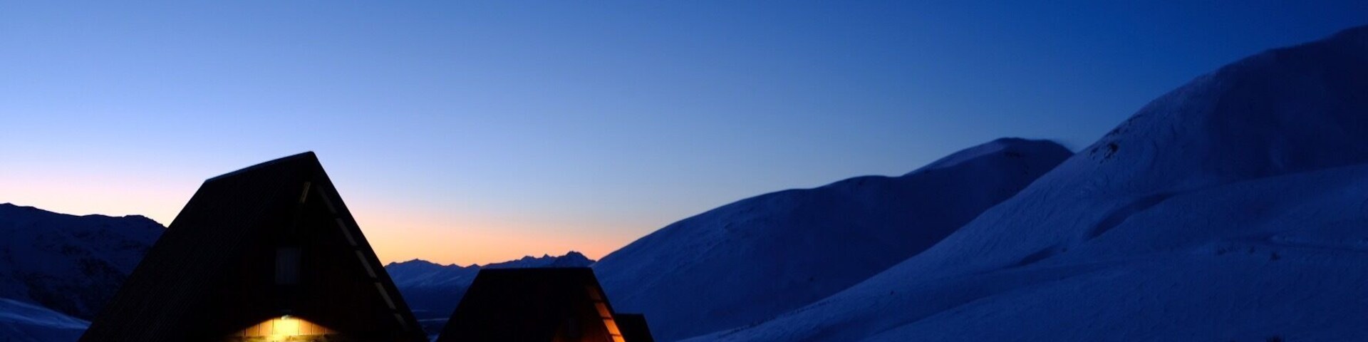 Peaceful winter morning in the #mountains with the warm glow of cozy cabins. #winterescape #wanderlust #alaska #hatcherpass #beforetheavalanche #mountain #dawn
