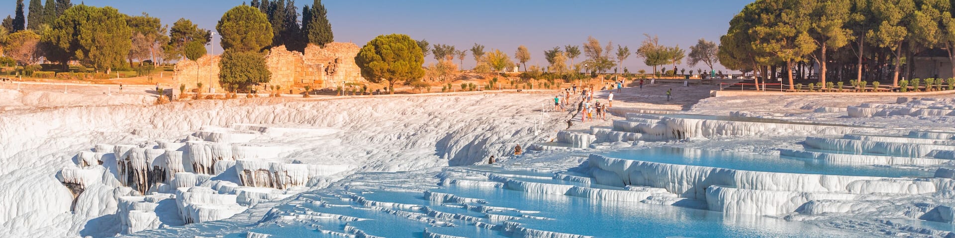One of the main tourist attractions in Turkey is the travertines and Pamukkale hot springs. Scenic panoramic view on turkish resort