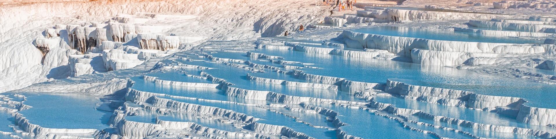 One of the main tourist attractions in Turkey is the travertines and Pamukkale hot springs. Scenic panoramic view on turkish resort