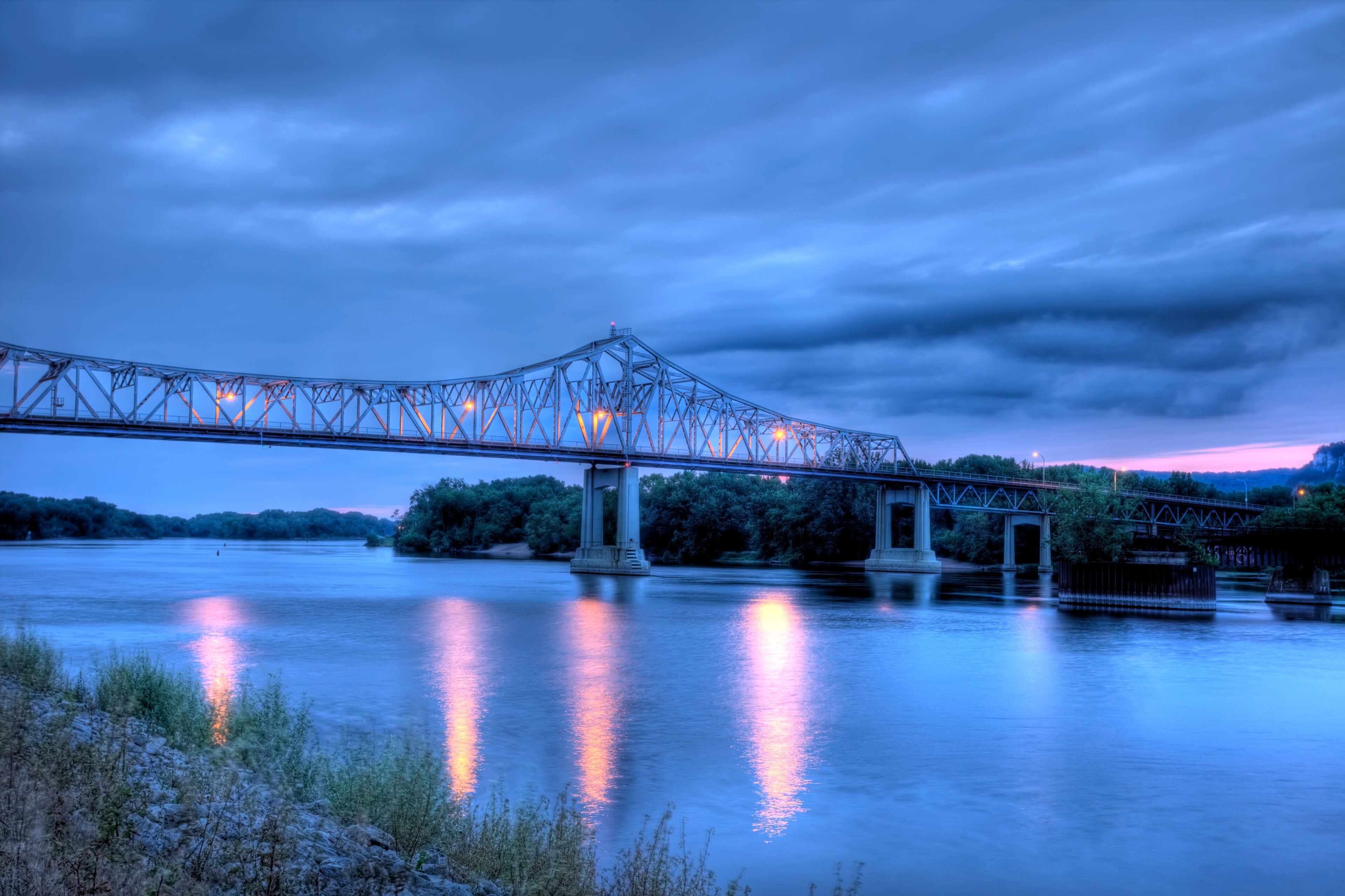 HDR image of bridge over the Mississippi River at dusk
