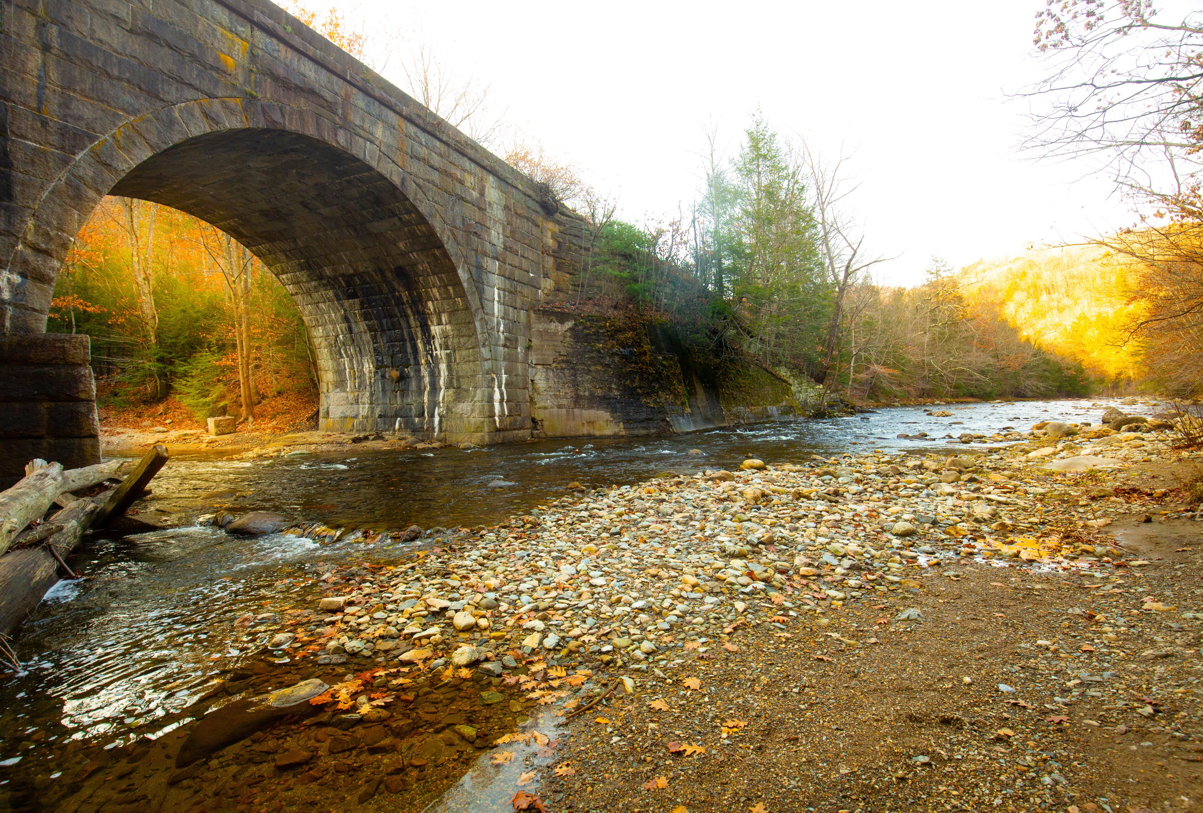 Stone arch of a railroad bridge over the Westfield River.