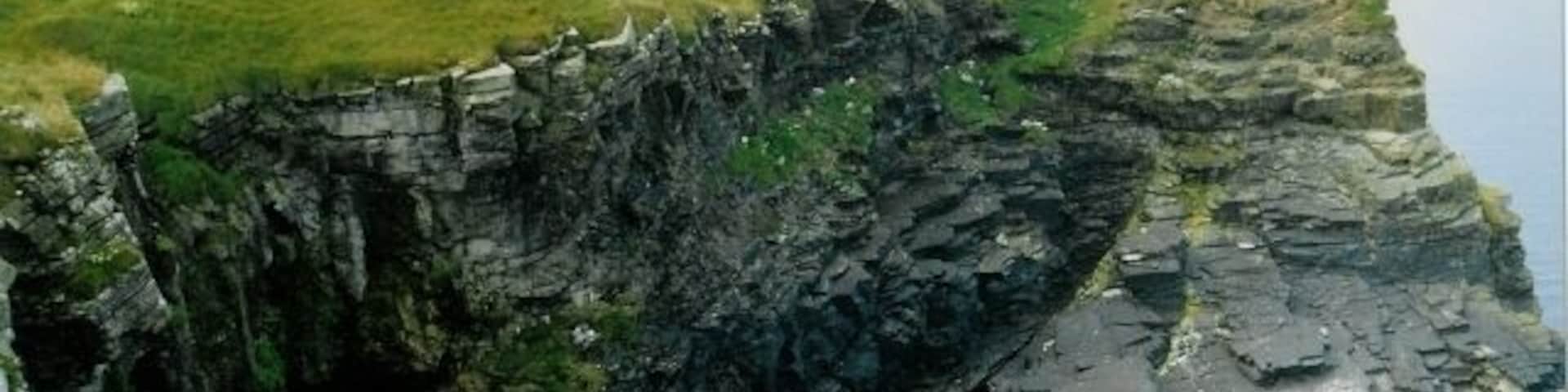 Cliffs at Rack Wick Small but spectacular cliffs beside Castle O'Burrian