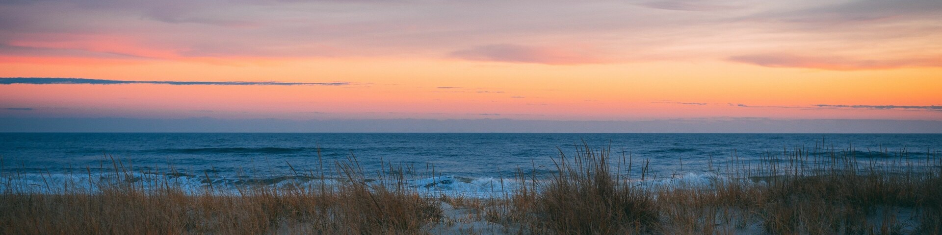Sand dunes and the Atlantic Ocean at sunset, at Smith Point, Fire Island, New York