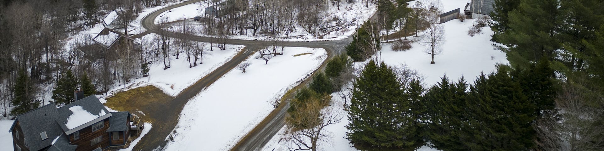 Drone view from above a West Dover Vermont neighborhood in winter