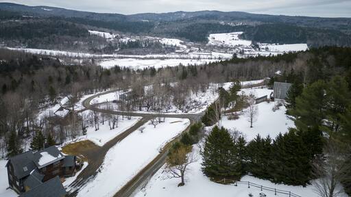 Drone view from above a West Dover Vermont neighborhood in winter