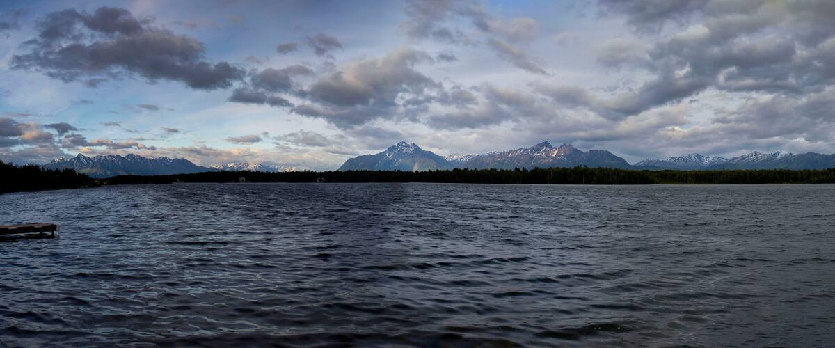 A lake with mountains in the background.