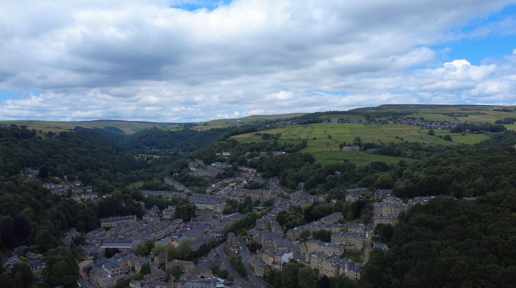 scenic aerial view of the town of hebden bridge town in summer surrounded by fields and trees
