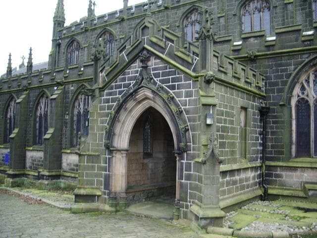 A historic building with Gothic architecture, featuring pointed arches and detailed stonework.