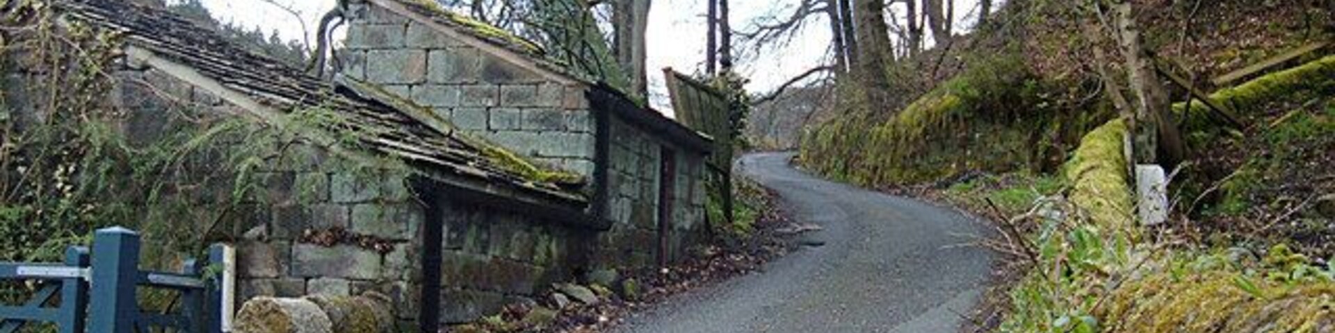 Lane to Higher House, Cragg Vale This lane crosses Withens Clough at a junction with Rud Lane near St John's church.
