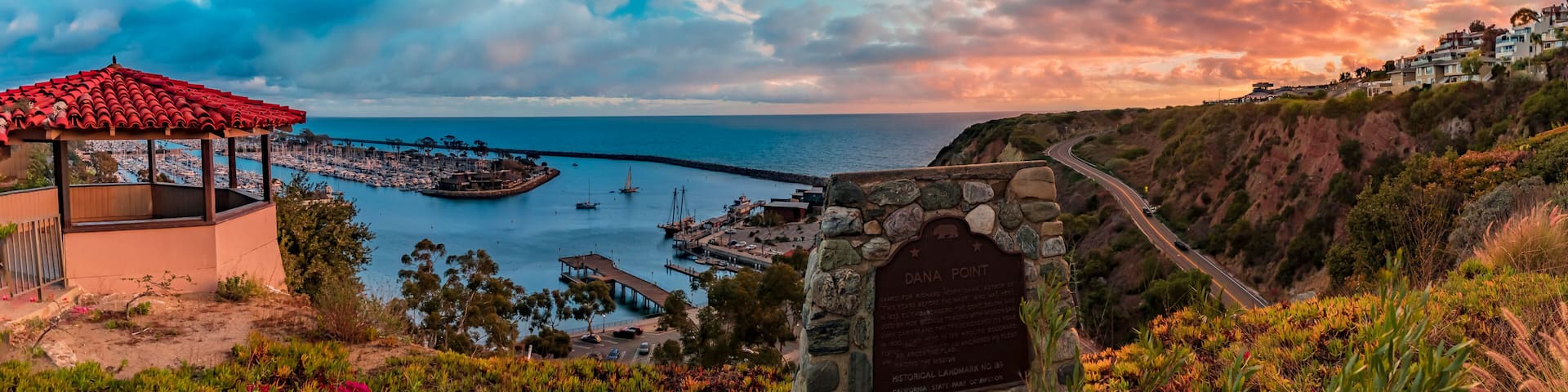 Sunset over luxury yachts and boats in Dana Point harbor, Orange county in Southern California