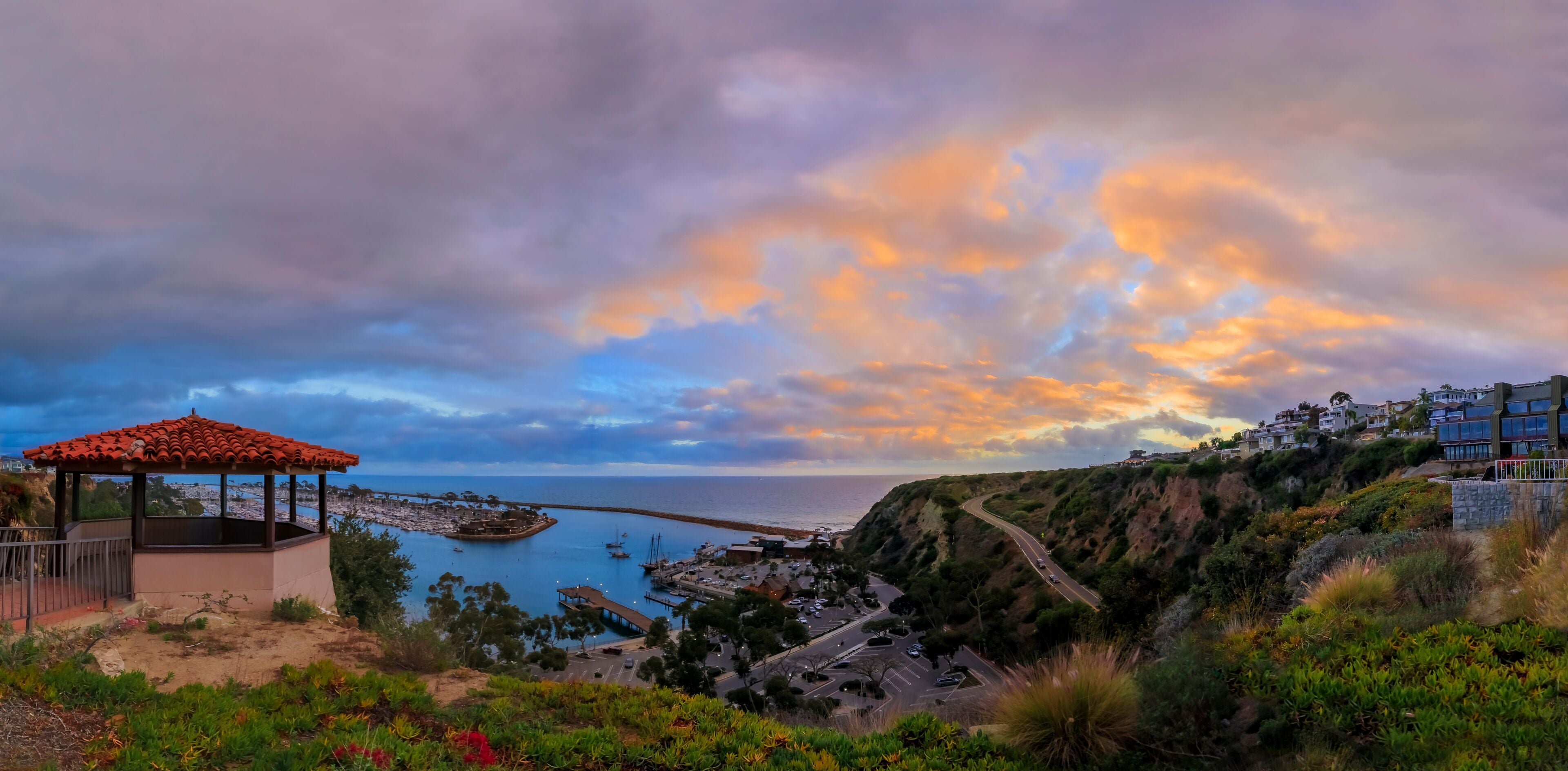 Sunset over luxury yachts and boats in Dana Point harbor, Orange county in Southern California