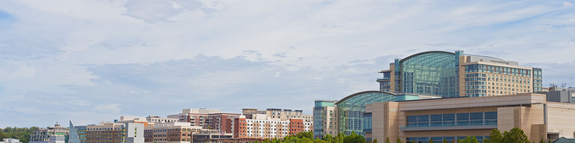 National Harbor waterfront panorama in Oxon Hill, Maryland, USA. Water transport pier services visitors coming from Washington DC.