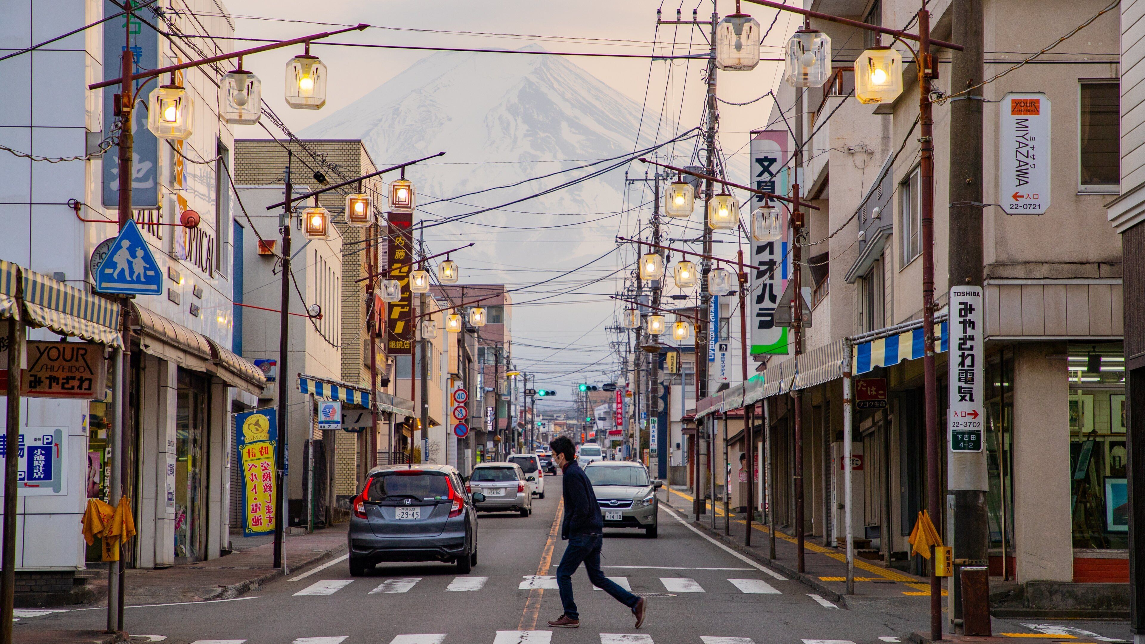 Fujiyoshida featuring street scenes as well as an individual male
