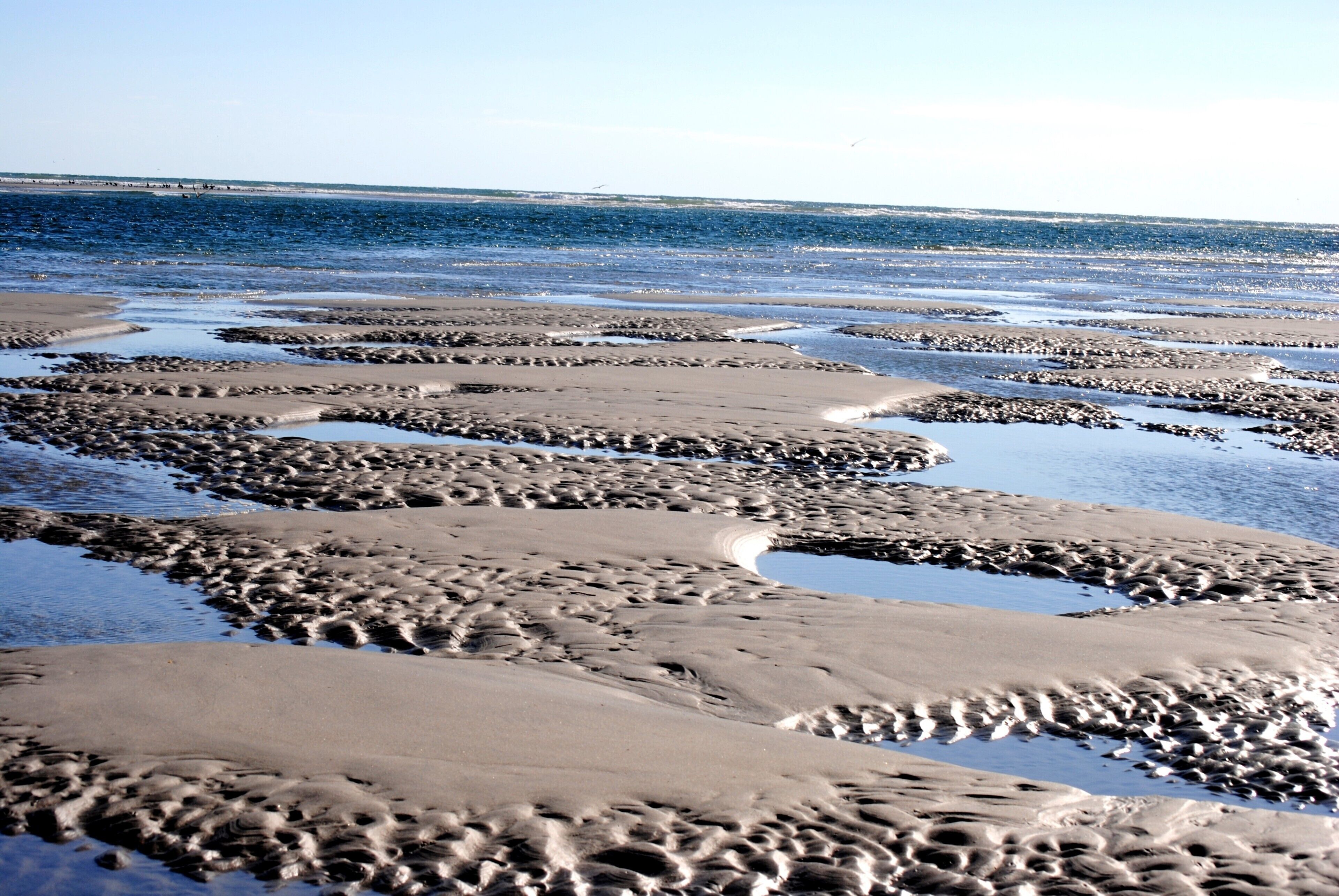 Whrightsville Beach  NC is a unique
quiet place with beautiful display of sand patterns and sand bars left after tide has gone out.
