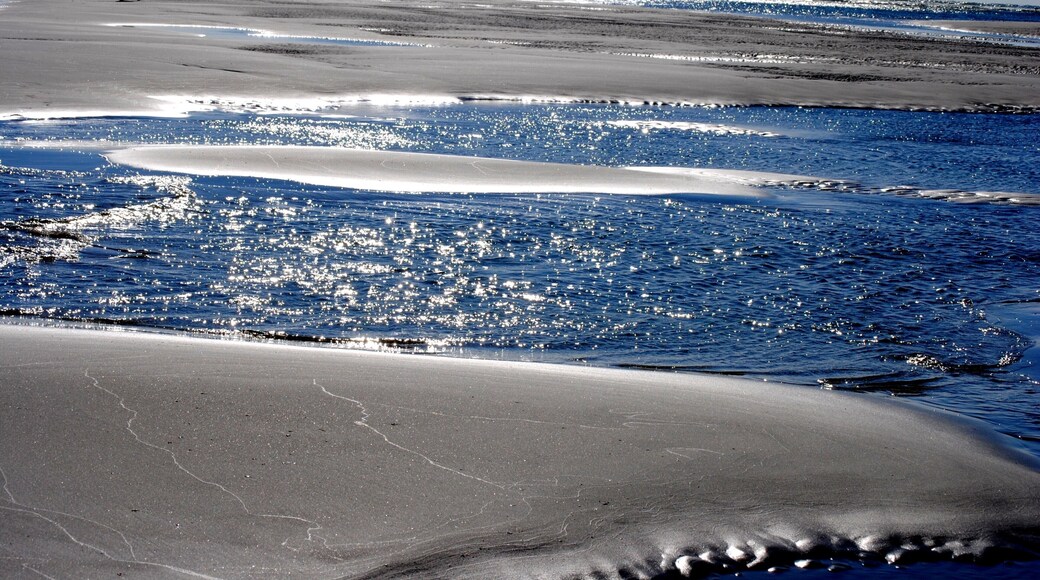 our favorite place to go when its beach time, is Wrightsville Beach NC as it is quiet .
what makes this beach so special is when the tide goes out.....it goes way out and leaves beautiful patterns in the sand along with interesting sandbar formations.