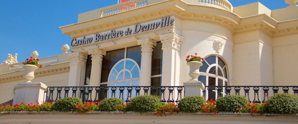 Deauville which includes signage, flowers and a casino