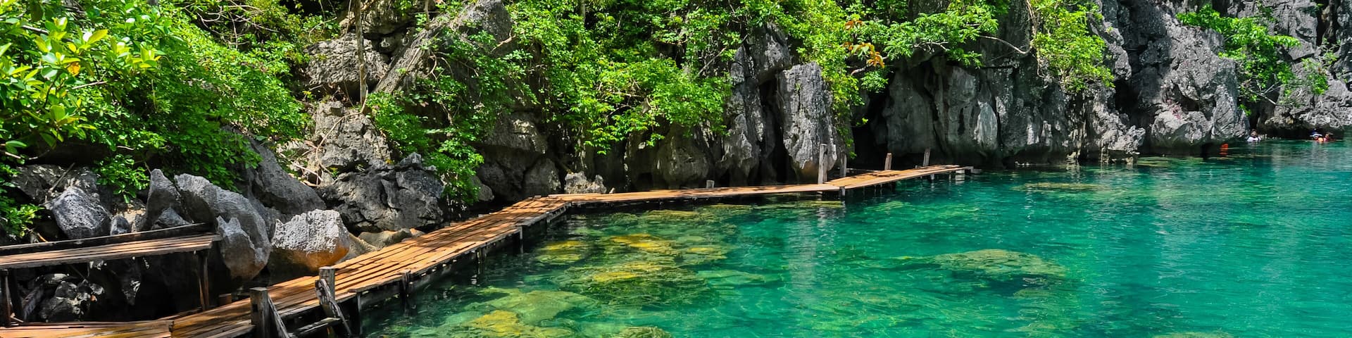 Very Clean and Clear lagoon lake Water next to a wooden path
