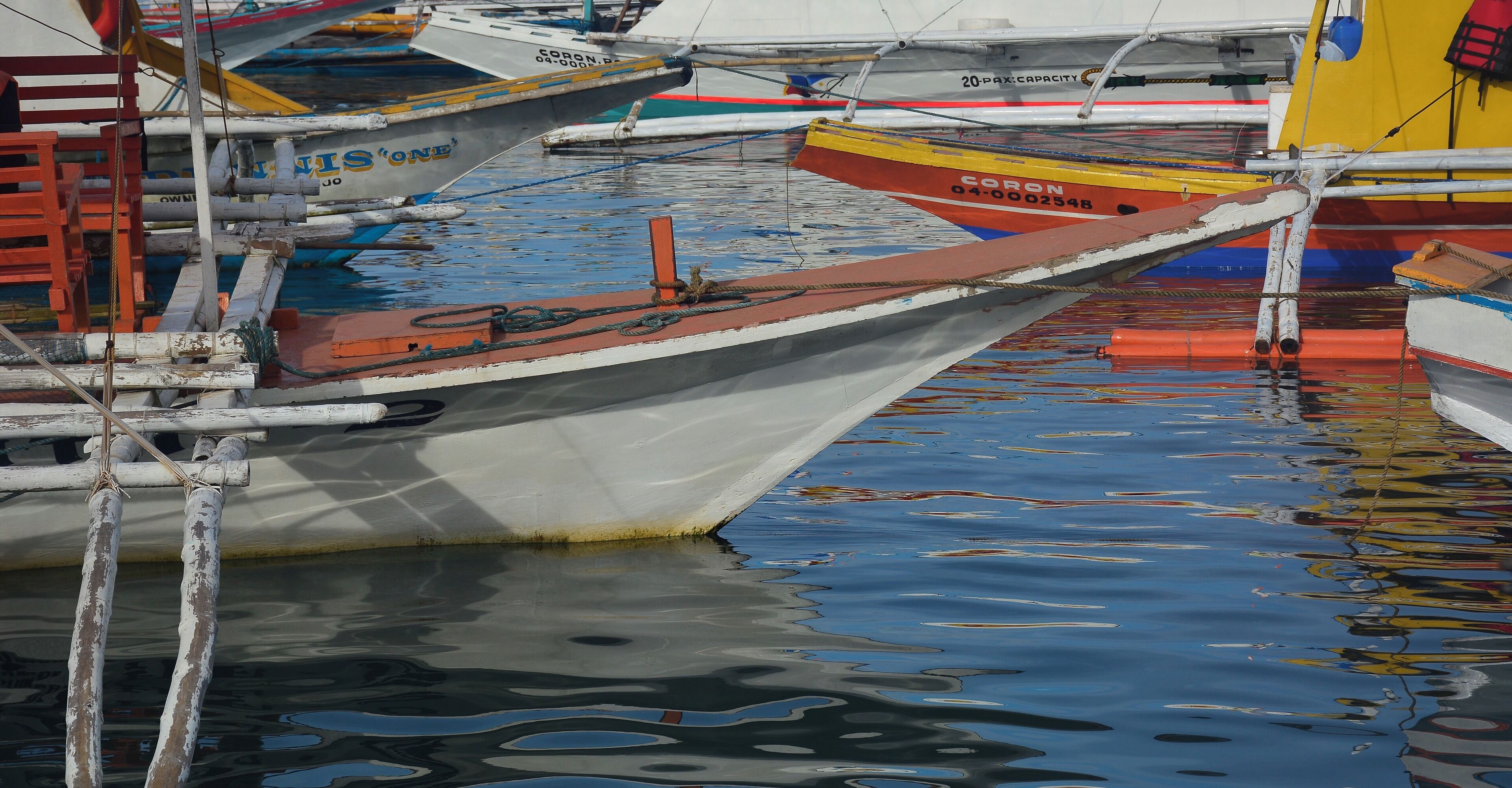 Banka Boats ready for the day at Coron harbor, Palawan, Philippines