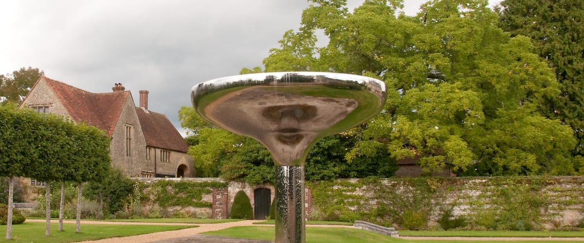 Seen looking North from All Hallows Churchyard the Fountain in the garden of Woolbeding House
