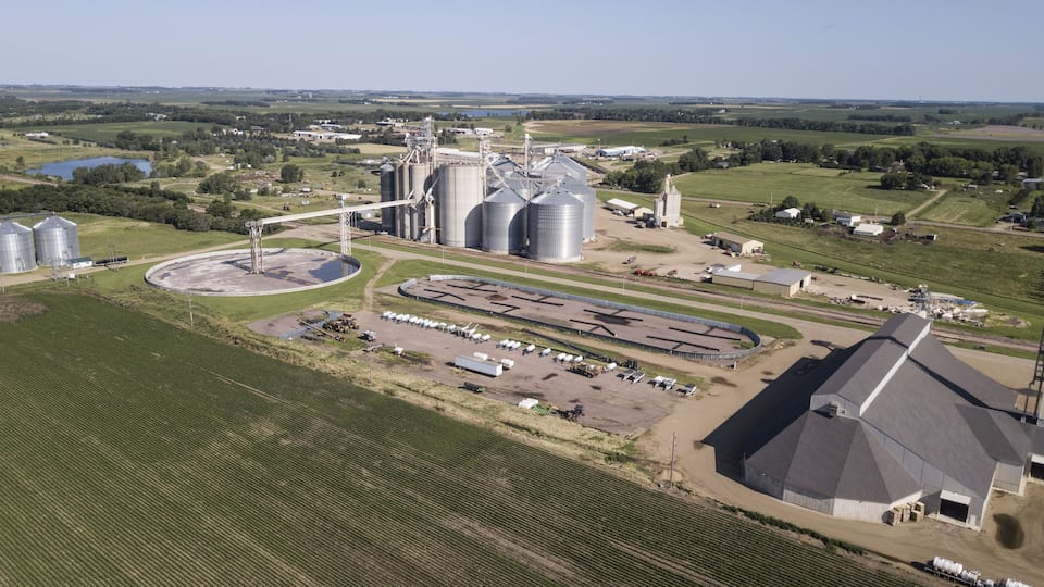 Aerial view of farmland and agricultural buildings in Madison, South Dakota.