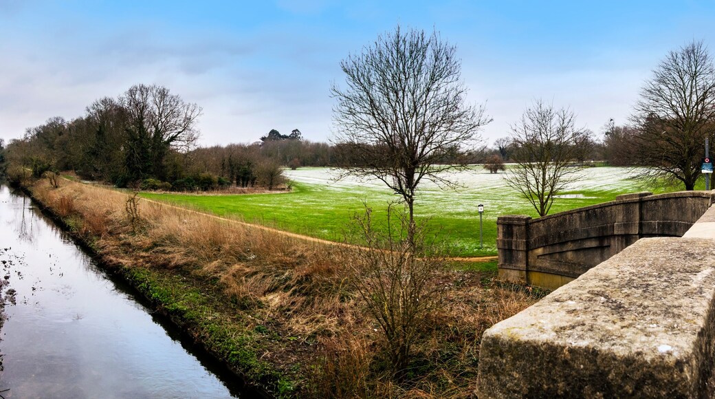Panoramic view of Cranford Park and river Crane after a mild snowfall in March.